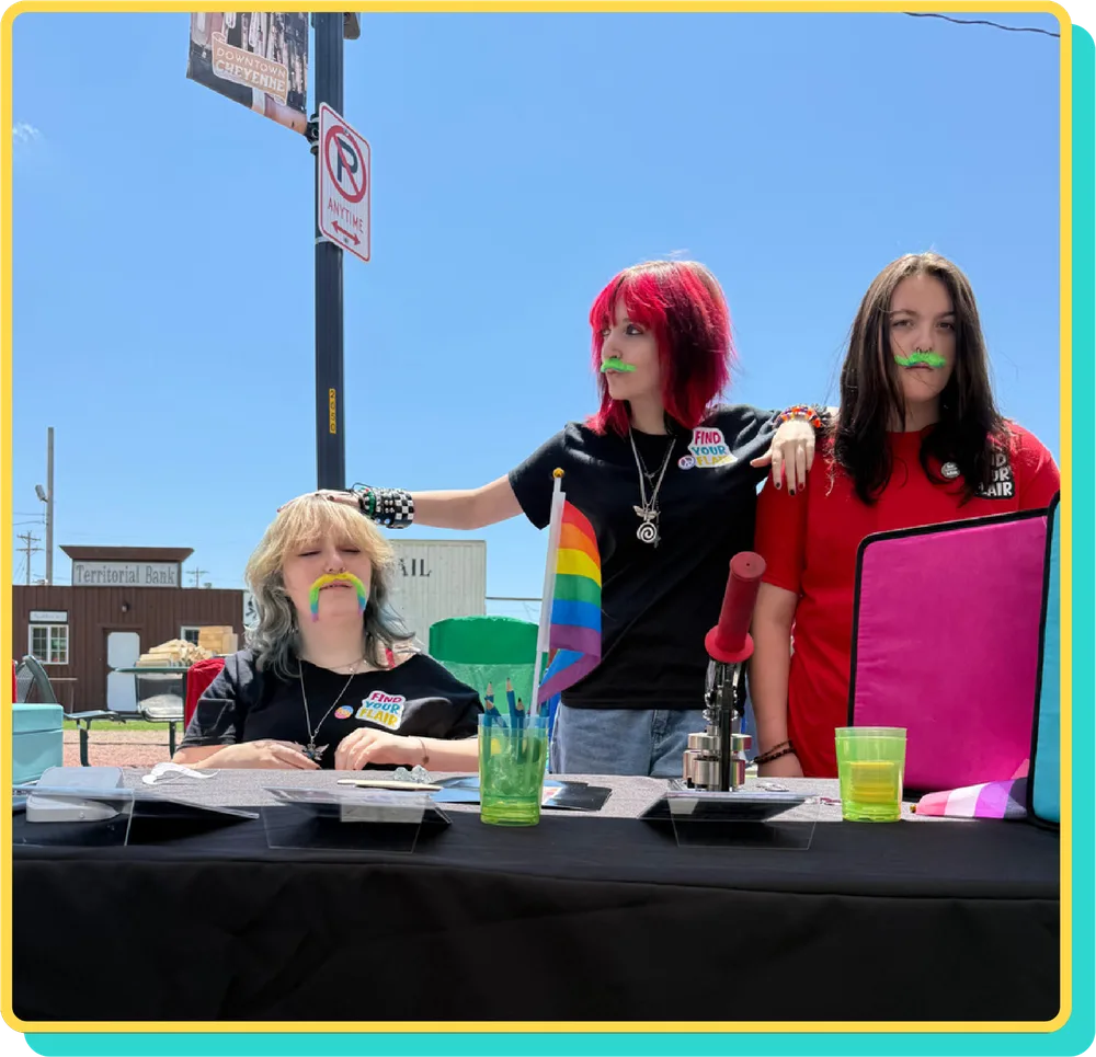 The Find Your Flair team at their table at an outdoor market